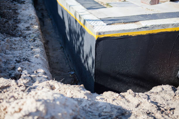 Professional Basement Waterproofing technician working in La Crosse, KS